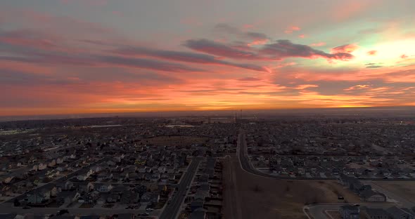 A drone flies forward over an epic urban sunrise in Northern Colorado.