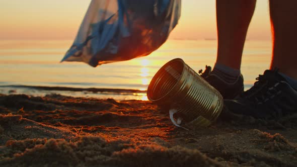 Volunteer Cleans the Beach From Plastic Bottles and Various Garbage