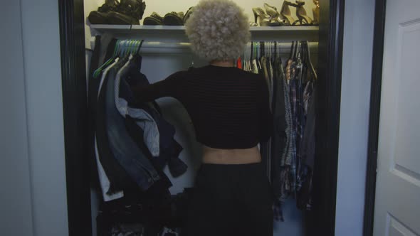 Transgender Woman Pushes Men's Clothes Away and Takes Women's Clothes