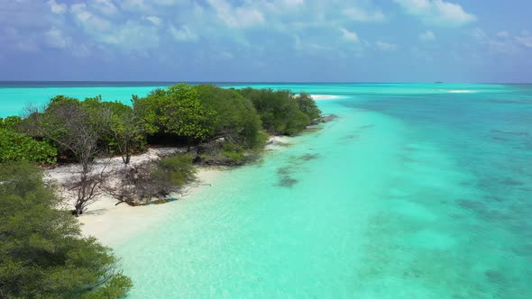 Daytime drone island view of a sandy white paradise beach and aqua blue ocean background 