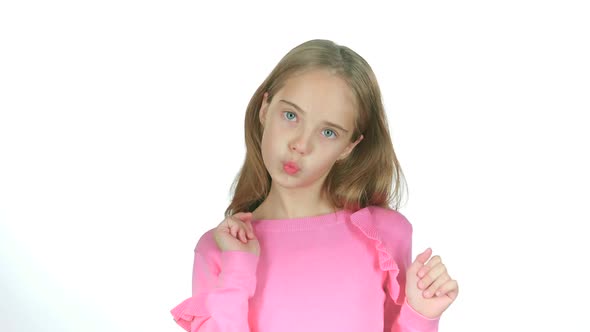 Child Girl Is Making Faces. White Background. Slow Motion