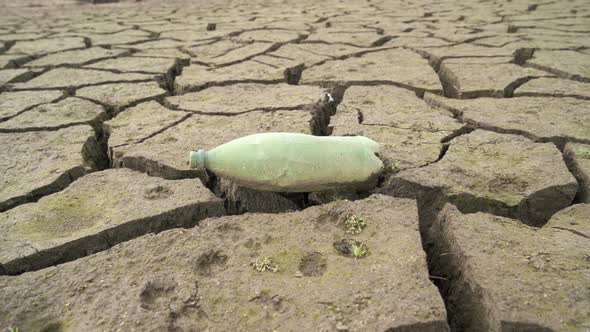 Empty Plastic Bottle Sitting on Dried Out Dam in Bulgaria. Studena Dam Near Pernik