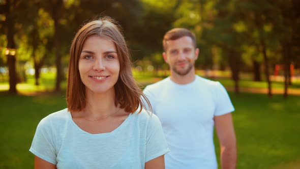 Friendly Woman and Man Wearing Sportswear Outdoor