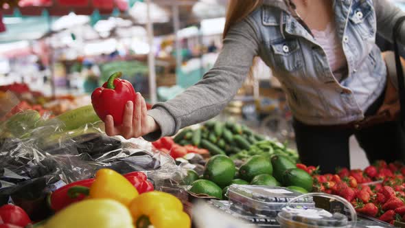 Young Attractive Woman Choosing Organic Fruits and Vegatables at Farmer's Market Close Up Shot Slow