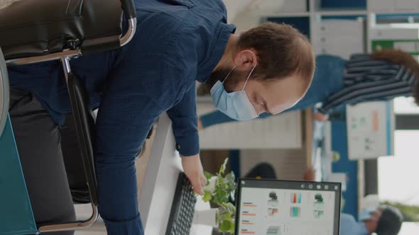 Video Vertical Paralyzed Man and Teamworkers Working in New Normal Office