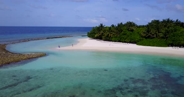 Natural birds eye abstract view of a white sandy paradise beach and blue sea background in vibrant 