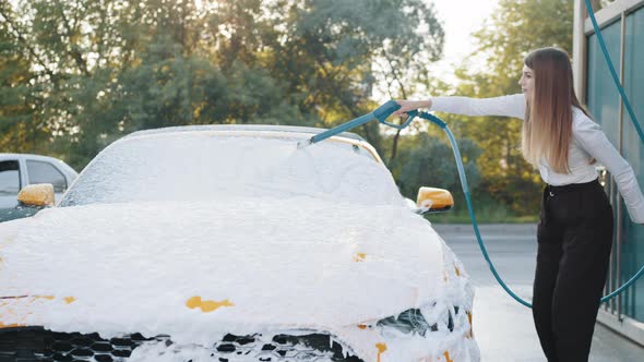 Washing of Modern Car on Open Air Self Car Wash Service with Foam and High