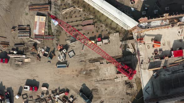 Aerial top down, crawler crane erected on foundation construction site