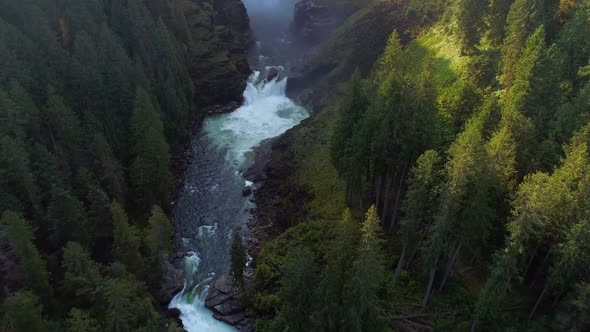 River flowing through green cliff 4k