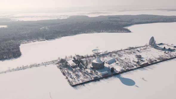 Aerial View of the Space Communication Station in Snow Covered Field at Sunny Winter Day Drone