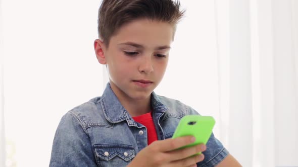 Boy with Smartphone at Home