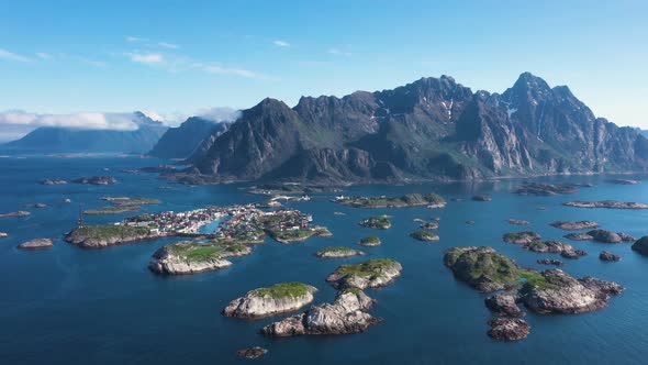 Flight over the sea and view on the fishing village Henningsvaer ,Lofoten Islands,Norway