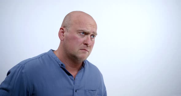 Bald Middle Aged Man Is Expressing Emotion of Sad, Disappointment, Astonishment, Doubtfulness