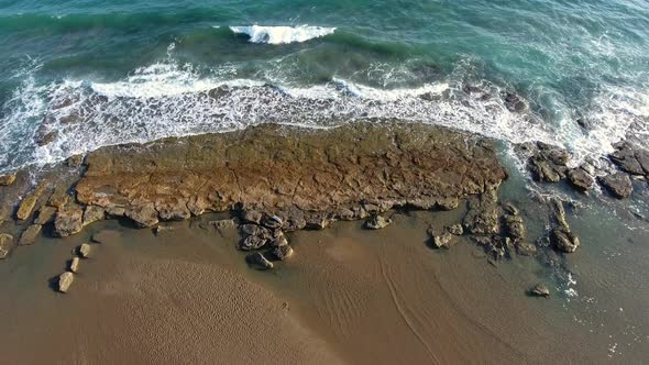 Shallow Rocky Reef Between the Sea and the Beach