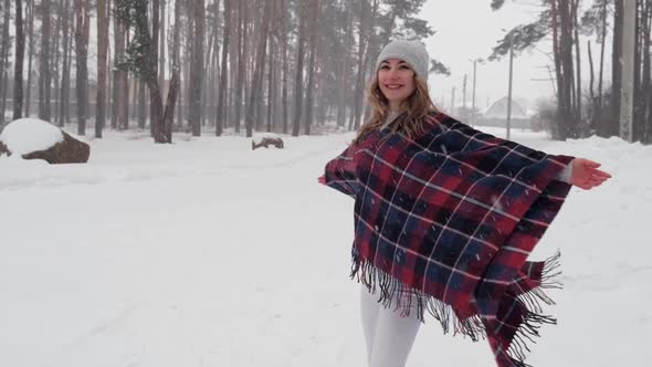 Dancing Woman Traveling Among Forest Wearing Hat and Poncho Boho and Wanderlust Style
