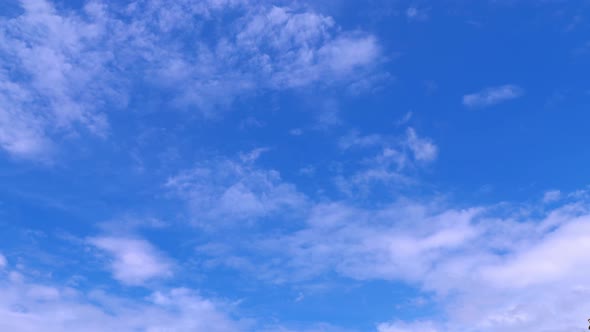 Blue sky white clouds. Puffy fluffy white clouds. Cumulus cloud cloudscape timelapse.