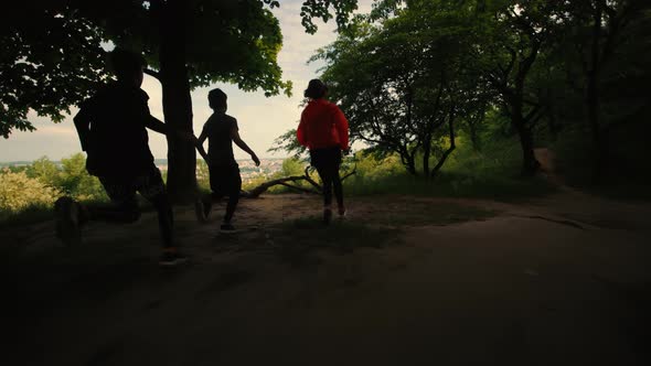 Children Run in the Woods Morning Run of Three Children One Girl and Two Boys Run Children's Morning