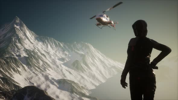 Woman and Helicopter in Winter Mountains