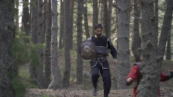 Soldier fleeing from the enemy in the Middle Ages. alt