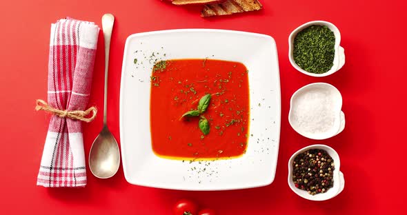 Tomato Soup Served in Plate with Spoon