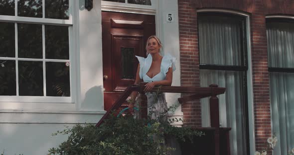 Woman stands on doorstep