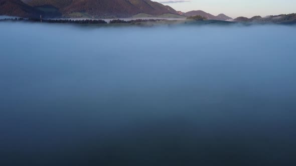 Misty Sea in Spring Green Rural Alpine Landscape at Sunrise