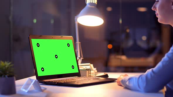 Businesswoman with Green Screen on Laptop at Night 72