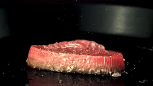 Super Slow Motion Tuna Steak is Fried in a Frying Pan