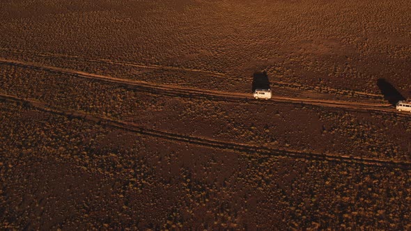 Aerial View Off Road 4X4 Car Driving Along Dirt Road Among the Desert