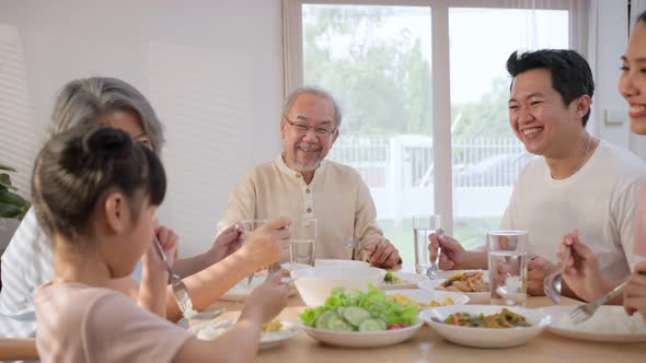 Multi-Generation relationship Asian Big happy family spend time have lunch on dinner table together