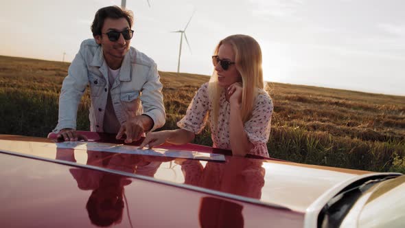 Video of couple indicating the destination of the trip. Shot with RED helium camera in 8K.