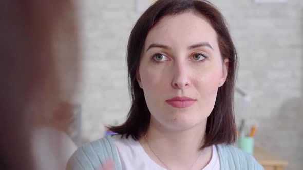 Closeup Face Beautiful Deaf Young Women Talking With Sign Language in the Living Room at Home