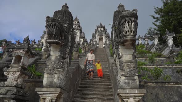 Slowmotion Shot of a Tourists Father and Son Visiting the Pura Lempuyang Temple at the Bali Island