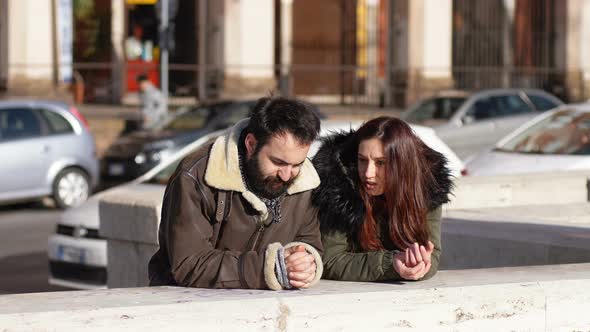 Young Serene and Relaxed Couple Chatting Enjoying a Sunny Day in The City