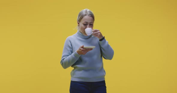 Young Woman Drinking Coffee