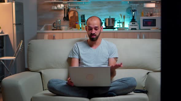 Focused Man Talking with Business People During Online Meeting Videocall