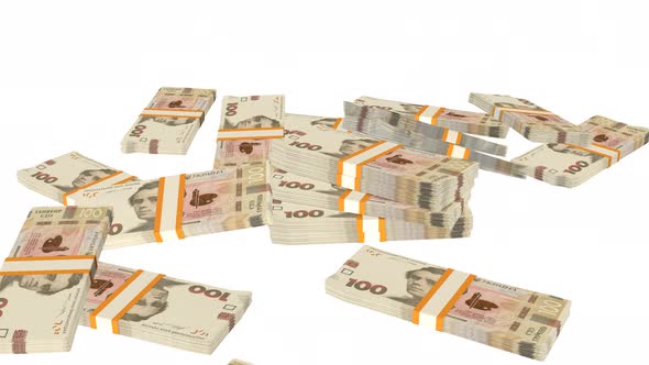 Many wads of money falling on table. 100 Ukrainian hryvnia banknotes. Stacks of money.