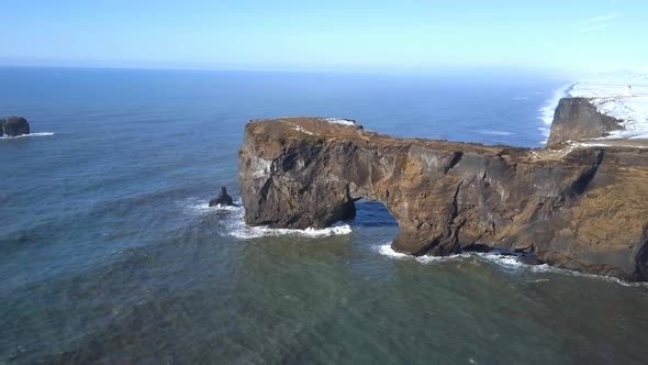 Dyrholaey Arch Aerial View of the Eroded Cliffs