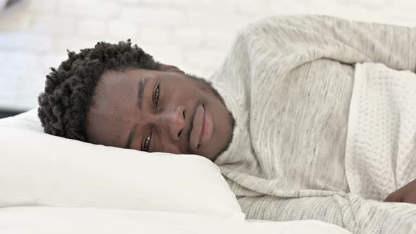 Waking Up African Man Smiling in Bed