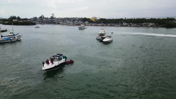 Tourists on Spring Break Enjoying Miami, Florida Ocean on Boats and Yachts - Aerial