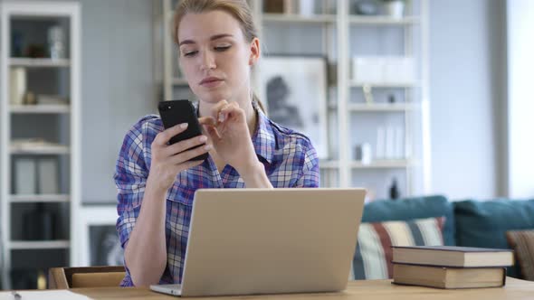 Woman Using Smartphone, Browsing online at Work