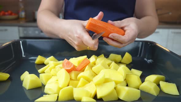 the Cook Cut the Carrots Into a Baking Sheet