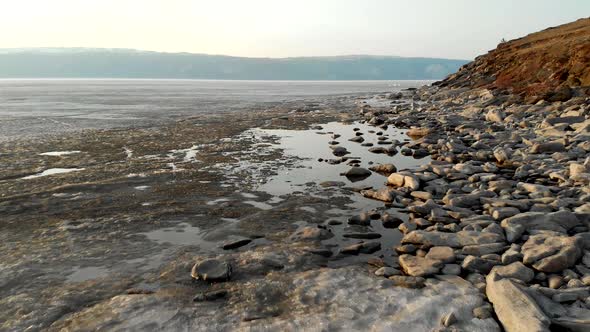 Ice and Water on Coast of Large Lake or River in Winter or Spring Closeup View Northern Landscape