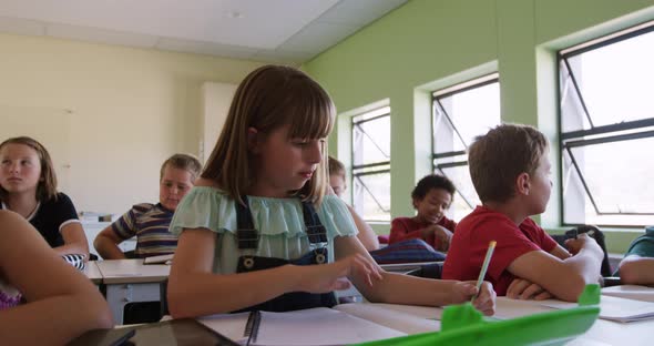 Group of kids studying in the class