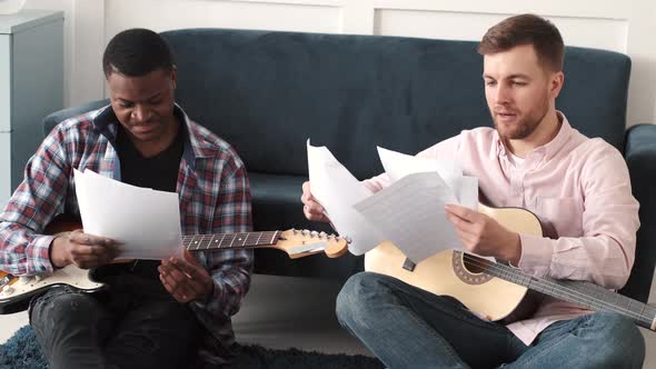 Two Friends Learn to Play Acoustic Guitar