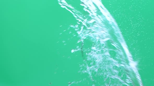 Slow Motion of Water Spash with Drops Over Green Screen Chroma Key Background