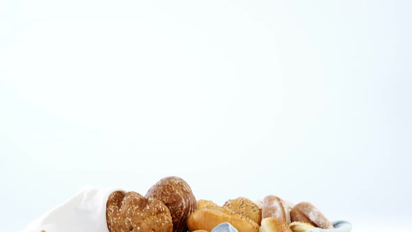 Various bread loaves on wooden table