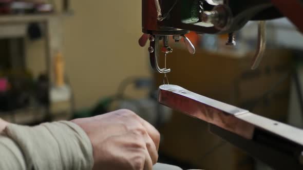 Shoes are Being Repaired in a Shoemaker's Shop