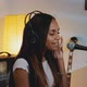 Black Female Vocalist in Headphone Recording Her New Song in Home Studio - VideoHive Item for Sale
