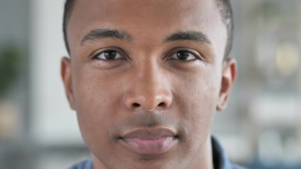 Serious Young African Man Face Looking at Camera